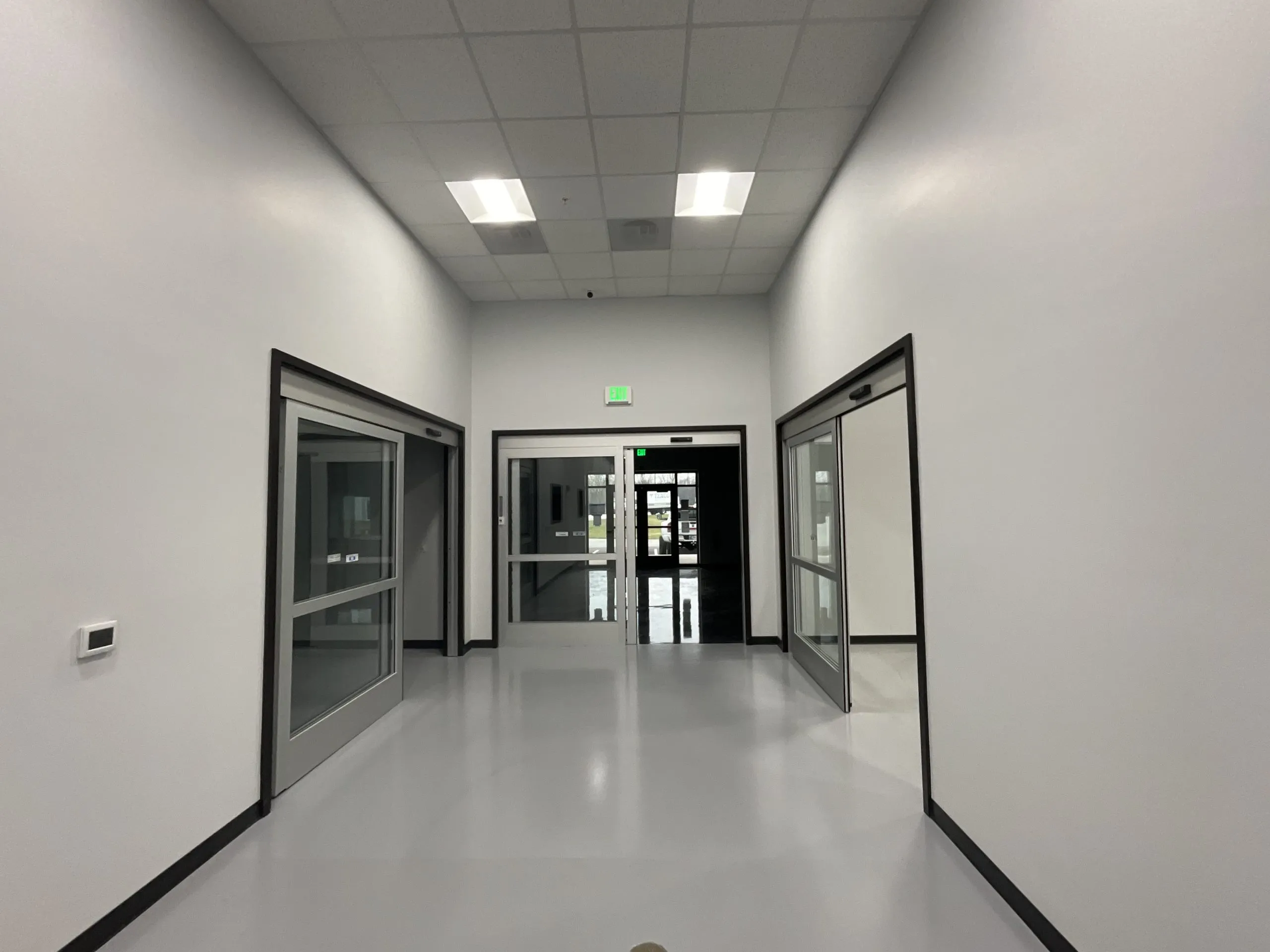 A finished corridor with our new overhead lighting