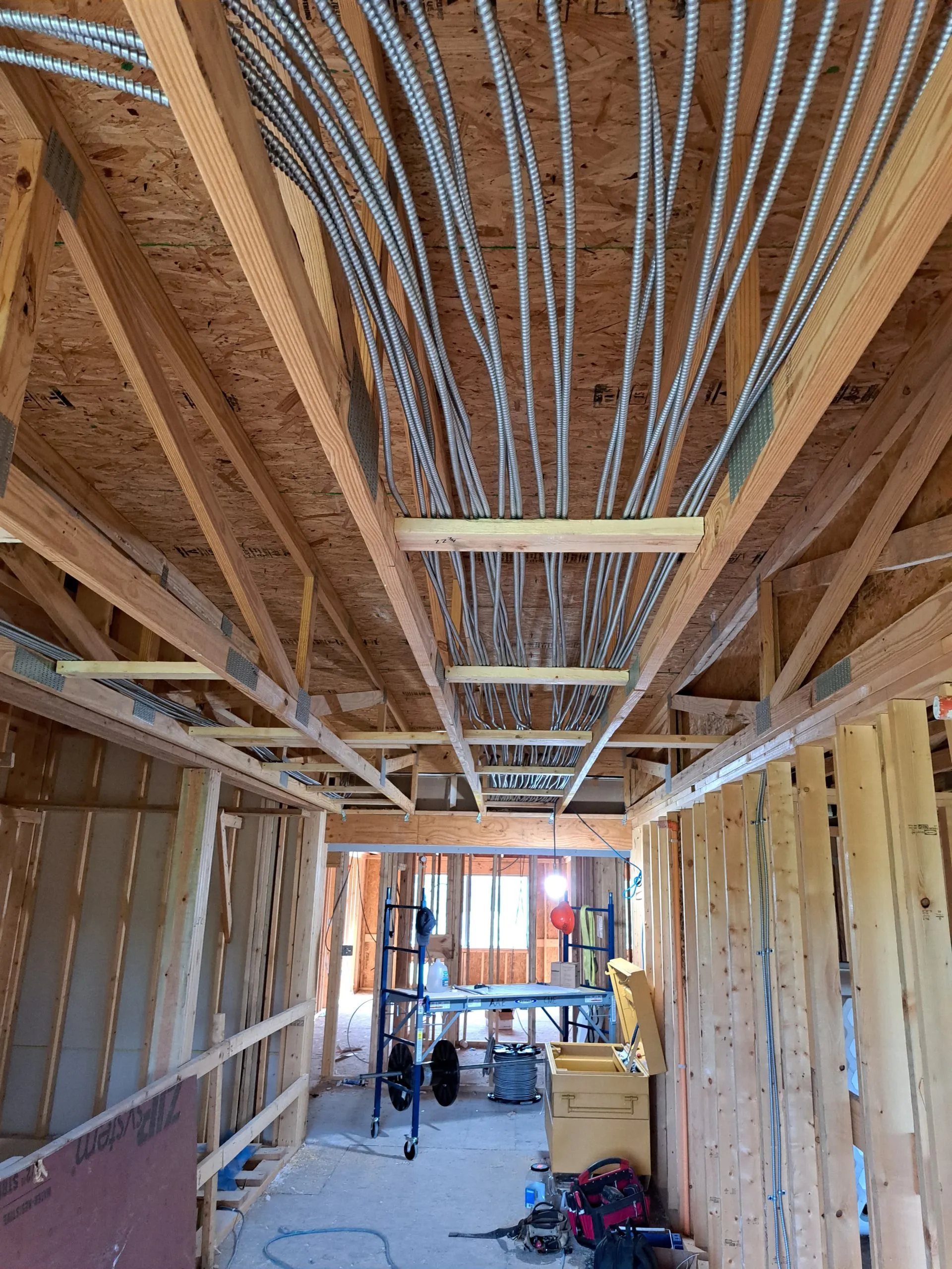 New-construction MC cable ceiling runs roughed in