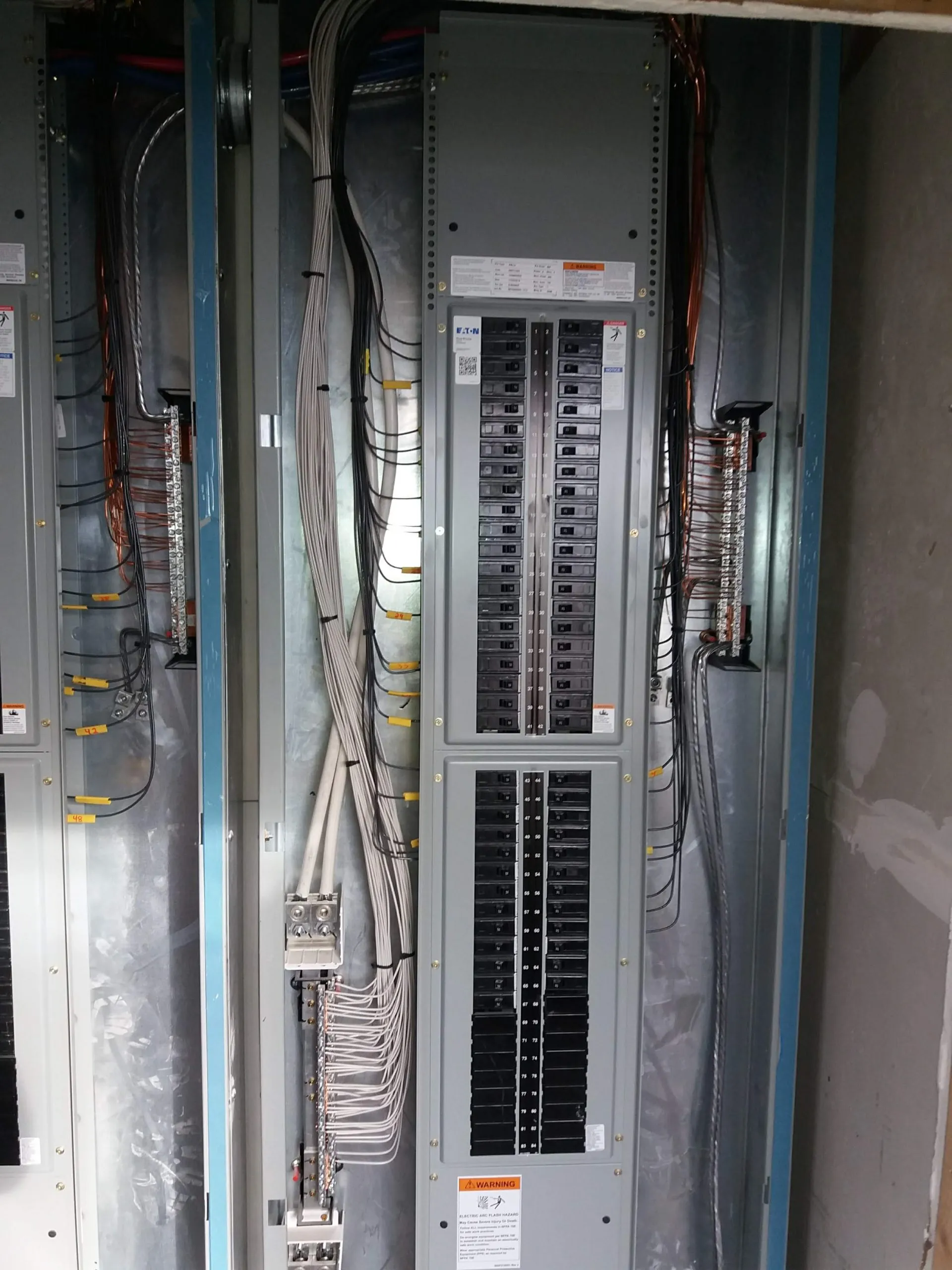 A large multi-circuit electrical service panel wired and labeled by our team